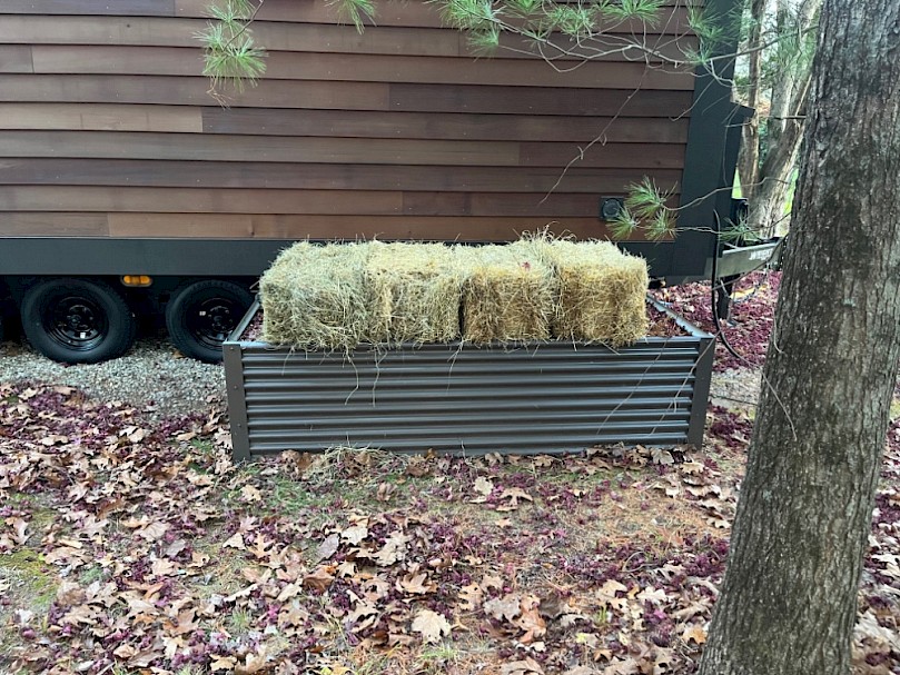 Hay bales added to the basin for insulation